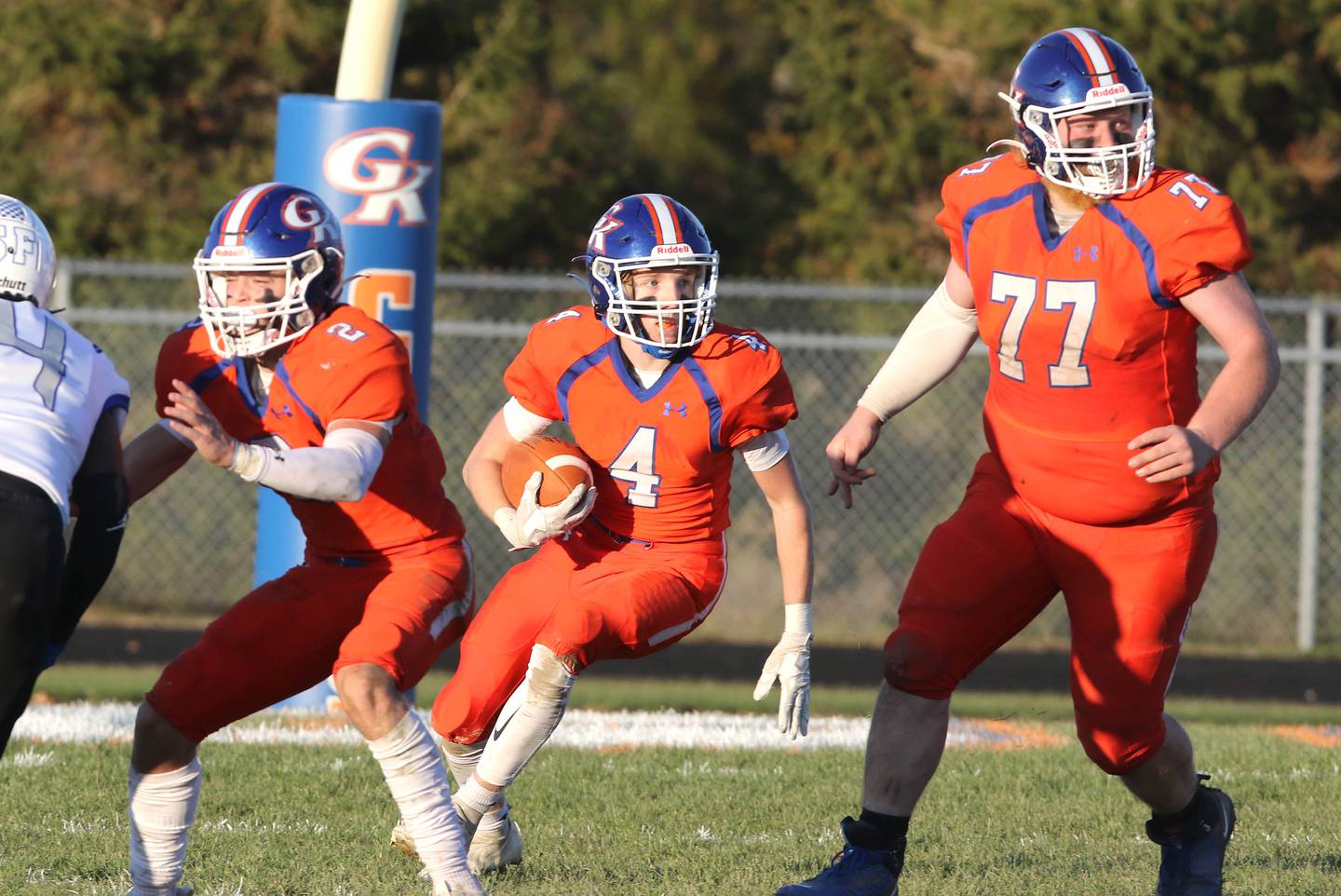 Genoa-Kingston's Ethan Wilnau follows Brody Engel and Owen Bohne through the St. Francis line Saturday, Nov. 6, 2021, during their IHSA Class 4A state playoff game at Genoa-Kingston High School.