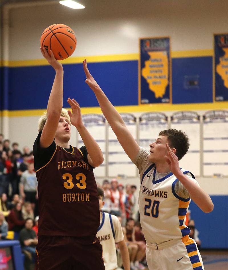 Richmond-Burton's Luke Robinson shoots the ball over Johnsburg's Josh Kaunas during the IHSA Class 2A Johnsburg Regional Championship boys basketball game on Friday, February, 27, 2026, at Johnsburg High School.