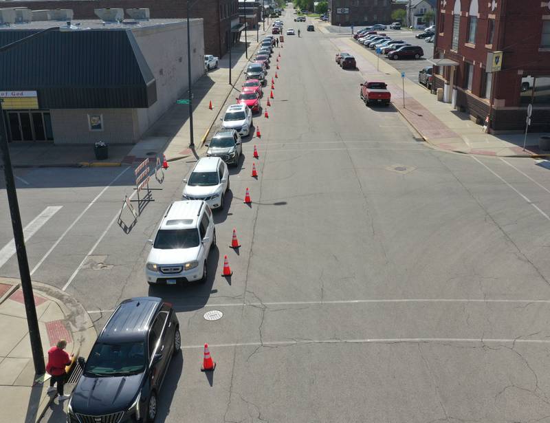 A long line of cars stretches all the way back to 2nd and Gooding Strett for the 27th annual Lighted Way Spaghetti Dinner on Monday, April 20. 2025 downtown La Salle.