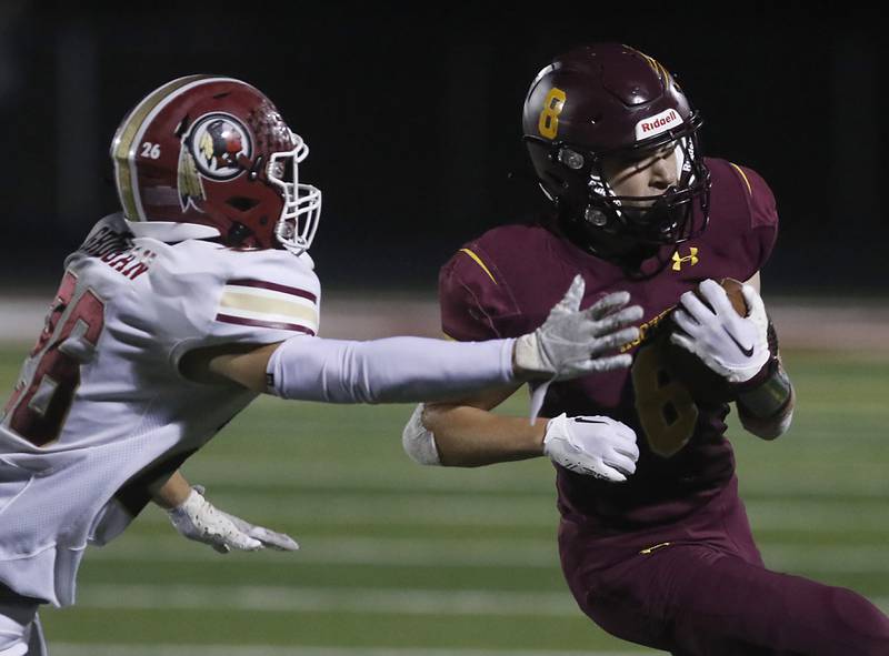 Richmond-Burton's Jack Martens, right, gets to the corner against Morris’ Broc Grogan during a Kishwaukee River Conference / Interstate 8 Conference crossover football game Friday, Sept. 30, 2022, between Richmond-Burton and Morris at Richmond-Burton Community High School in Richmond.