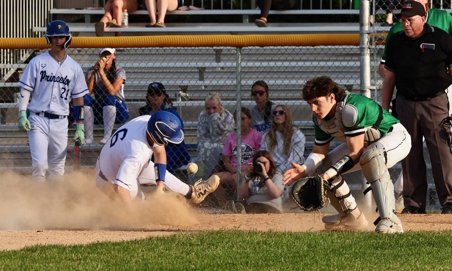 Princeton's Braden Shaw beats the throw home to Seneca catcher Joey Arnold in Thursday's game at Prather Field in Princeton. The Irish won 8-6.