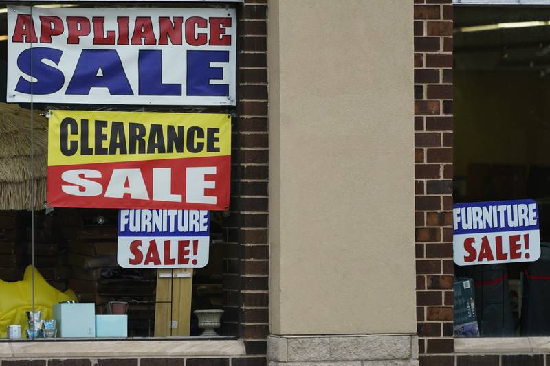 Sale signs are displayed at an appliance store in Arlington Heights, Ill., Wednesday, Nov. 8, 2023. On Tuesday, the Labor Department issues its report on inflation at the consumer level in October. (AP Photo/Nam Y. Huh)