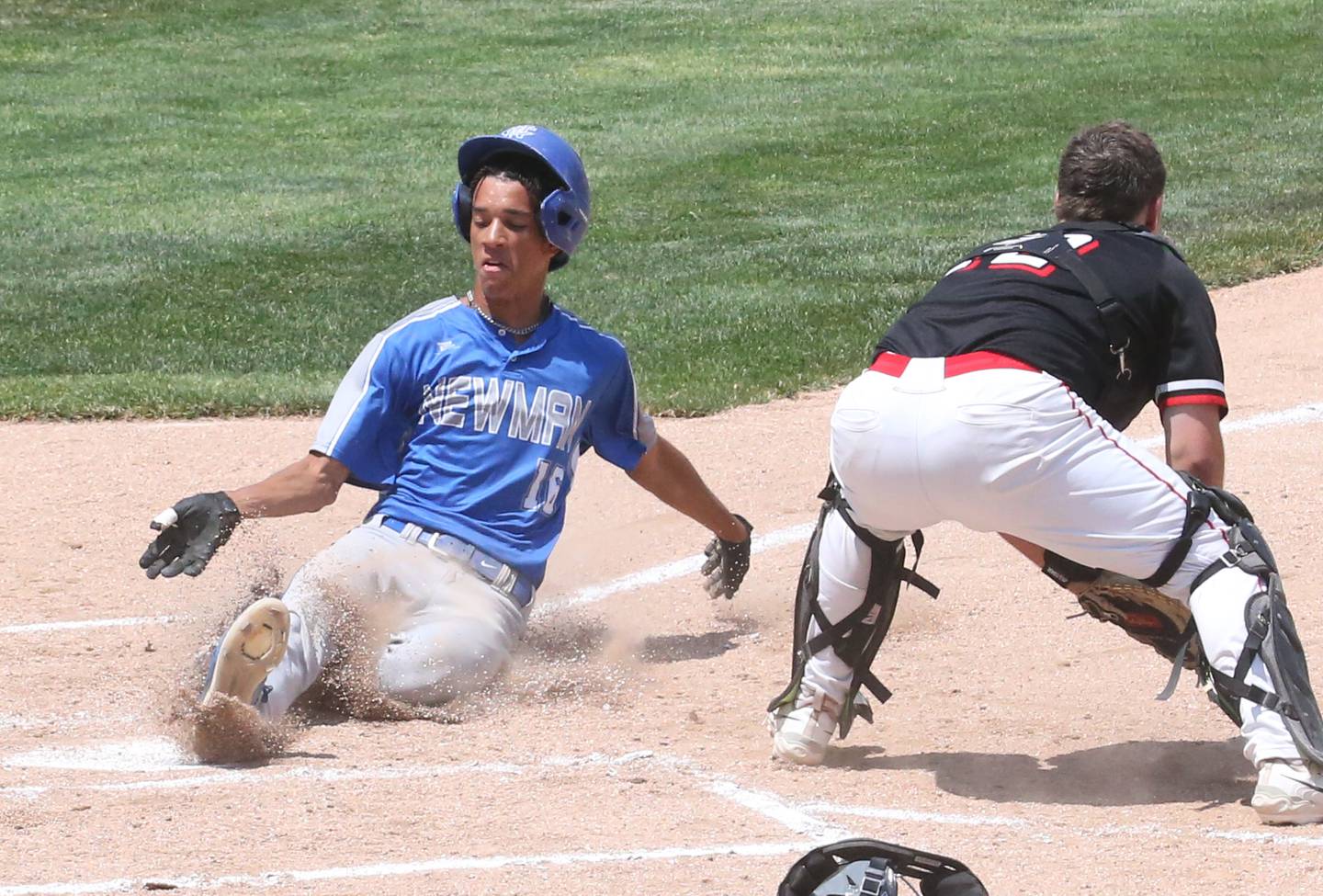 Newman's Isaiah Williams scores the teams only run while Henry-Senachwine catcher Colton Williams waits for the late throw to the plate during the Class 1A state semifinal game on Friday, June 2, 2023, at Dozer Park in Peoria.