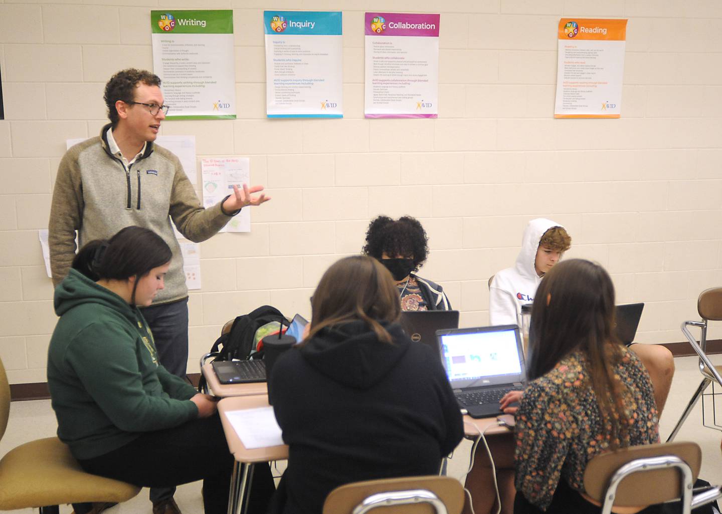 Teacher John Liuzzi talks about a college research project with his students Wednesday, March 23, 2022, as he teaches the Advancement Via Individual Determination, or AVID, class for freshmen at Woodstock North High School.