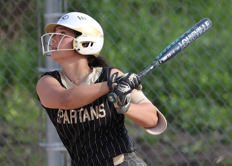 Sycamore's Kairi Lantz watches her ball as she flies out to deep center field Monday, May 12, 2025, during their game against Ottawa at Sycamore High School.
