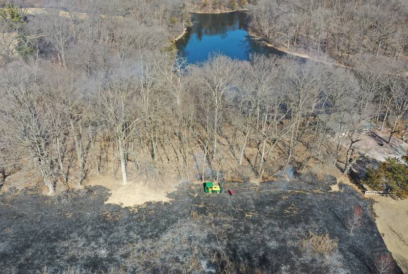 Crews burn off part of the green area for a controlled burn on Monday, March 2, 2026 at Deer Park Golf Club in Oglesby. The burn helps to manage invasive species, remove thatch buildup, and encourage the growth of native plants.