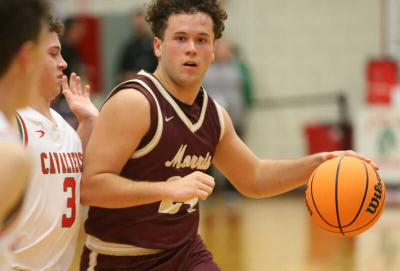 Morris's Colin Pfeifer looks to pass the ball as L-P's Mikey Hartman defends on Friday, Dec. 6, 2024 in Sellett Gymnasium at L-P High School.