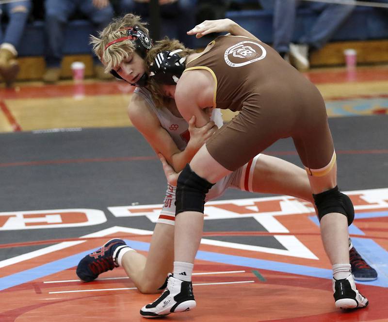 Marian Central's Austin Hagevold tries to control Mt. Carmel's William Gralton-Hodgetls in their 113-pound match during a triangle wrestling meet on Saturday Jan. 11, 2025, between Marian Central, Joliet Catholic, and Mt. Carmel at Marian Central High School in Woodstock.