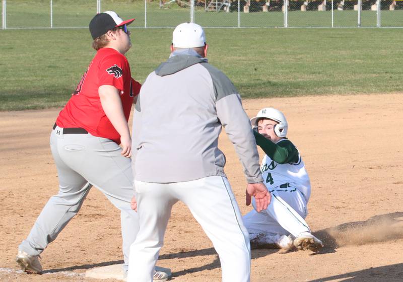 St. Bede's Gino Ferrari slides safely into third base as Indian Creek's Derrick Milostan makes a late catch on Thursday, March 28, 2024 at St. Bede Academy.