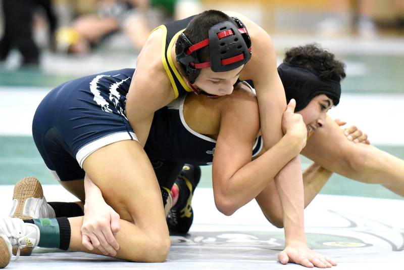 Reed-Custer's Colton Drinkwine, left, gets position atop Hope Academy's Indigo Berg during the 106-pound championship match at the IHSA Class 1A Coal City Sectional Saturday, Feb. 15, 2025.