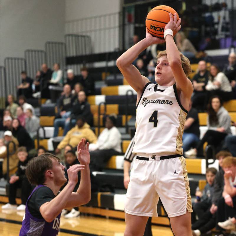 Sycamore's Isaiah Feuerbach shoots over Dixon’s Brady Feit during their game Tuesday, Jan. 14, 2025, at Sycamore High School.
