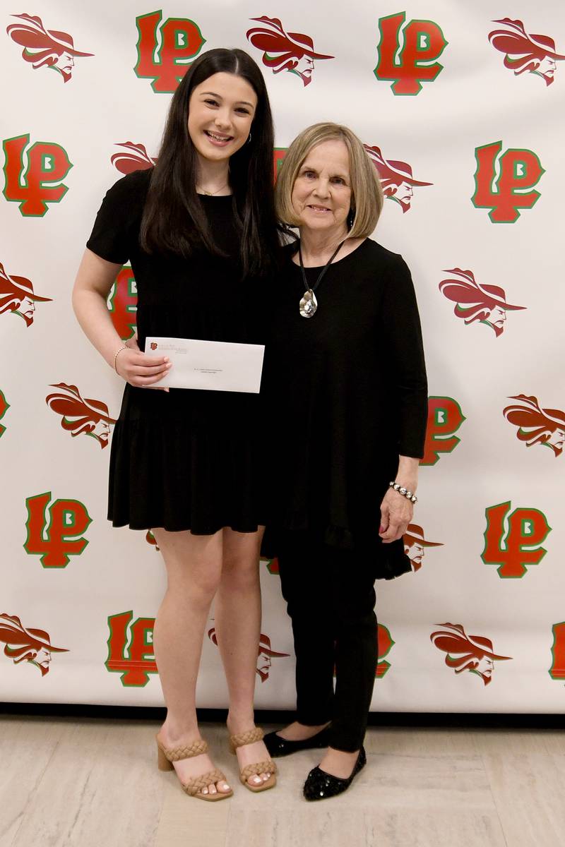 Isabella Argubright (left) received the Dr. A.J. Sellett Medical Scholarship for students planning to pursue a career in medicine. This $1,000 scholarship was presented by Sharon Lamps (right).