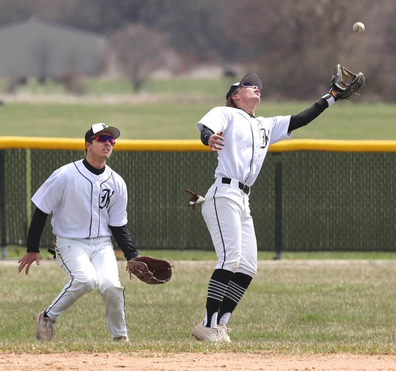 Kaneland's Dylan Conklin goes after a fly ball as Anthony Campise backs him up during their game against DeKalb Friday, April 15, 2022, at Kaneland High School in Maple Park.
