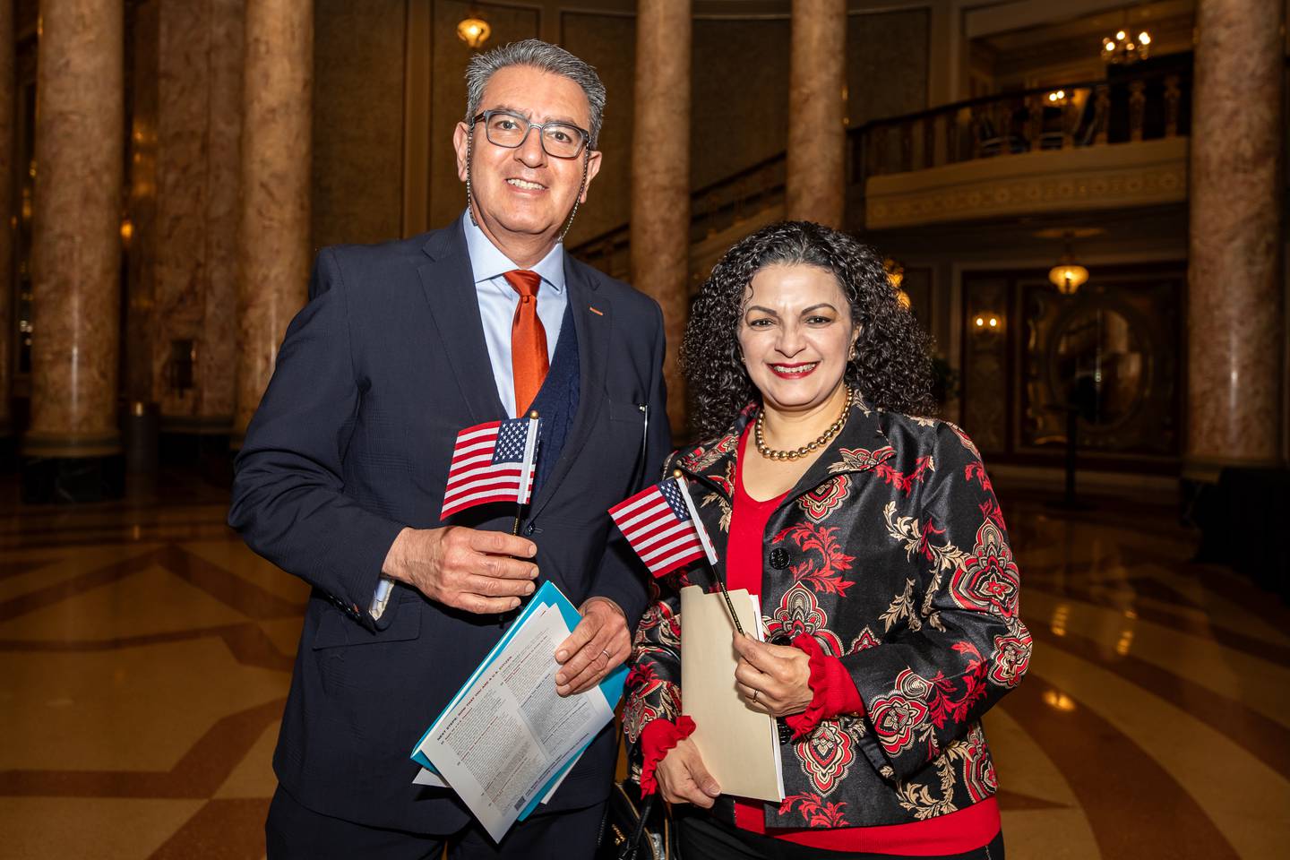 Naperville residents, and new citizens, Juan Carlos Lara and Alejandra Perez Madrigal, stop for a photo before the Naturalization Ceremony at Rialto Square Theatre in Joliet on April 17, 2025.