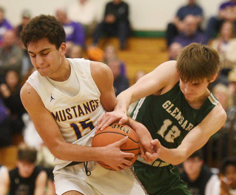 Rolling Meadows’ Kenan Pekovic, left, takes the ball from Glenbard West’s Dominic Seaney during the Jack Tosh Holiday Classic boys basketball tournament, played in Elmhurst on Tuesday, December 26, 2023.