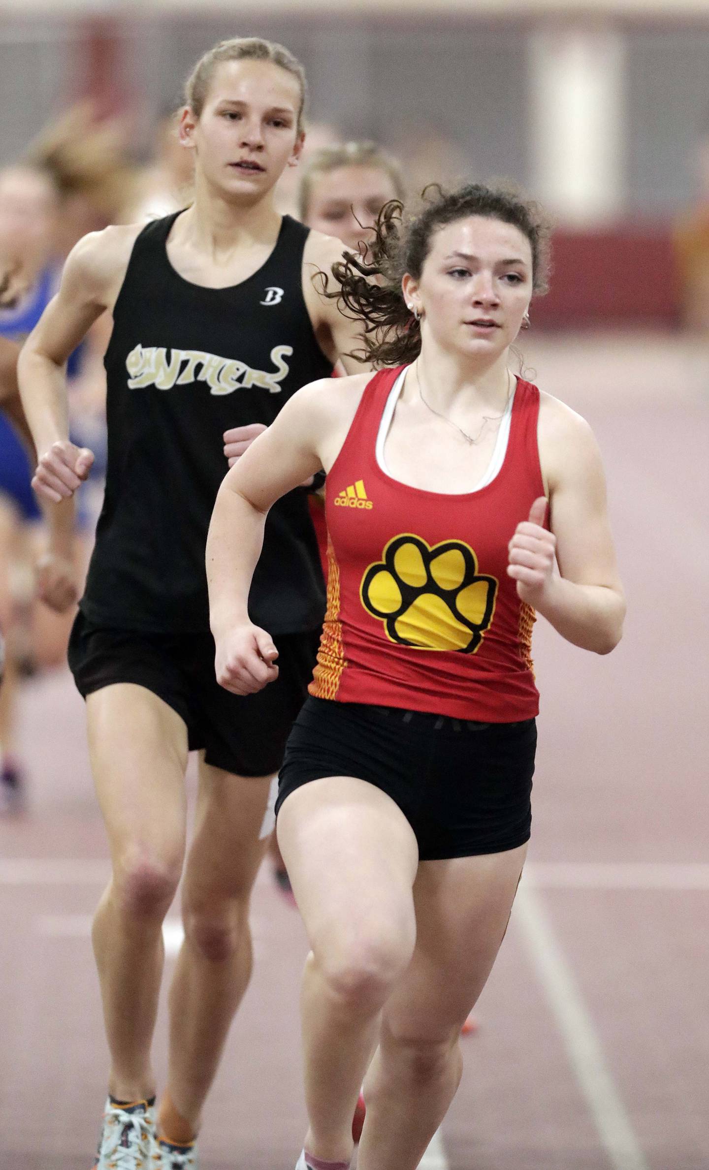 Batavia’s Katrina Schlenker and Glenbard North’s Grace Schager in the 3200 during the DuKane Girls Indoor Championship track meet Friday March 18, 2022 in Batavia.