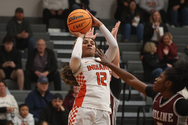 Minooka’s Naya Carter puts up a shot against Moline in the Class 4A Minooka Regional championship game on Thursday, Feb. 19, 2026 in Minooka.