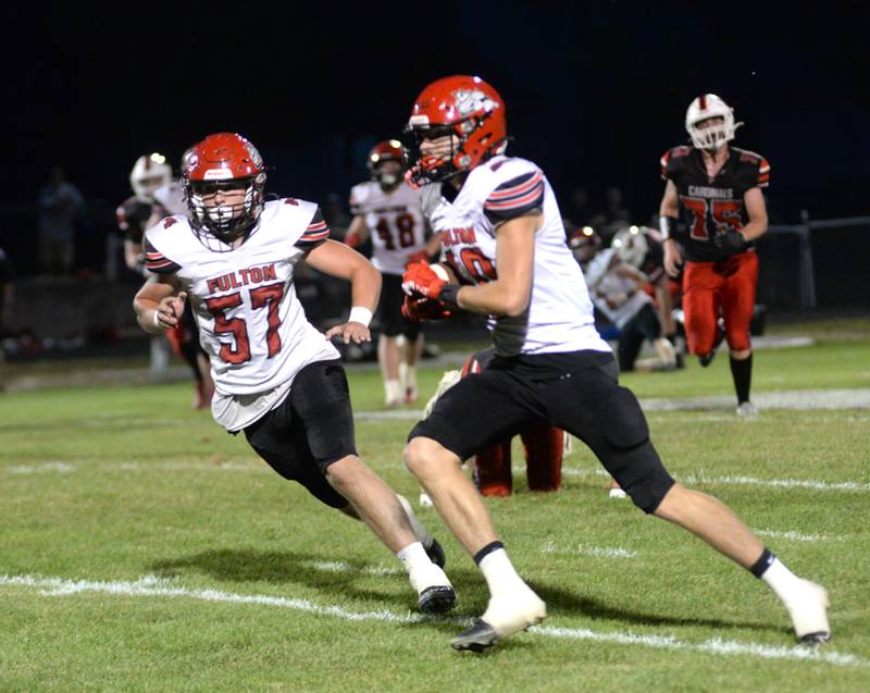 Fulton's Landen Leu (10) runs with the ball after catching a pass with Kody Schipper (57) looking to block during action against Forreston on Friday, Sept. 12, 2025 in Forreston.