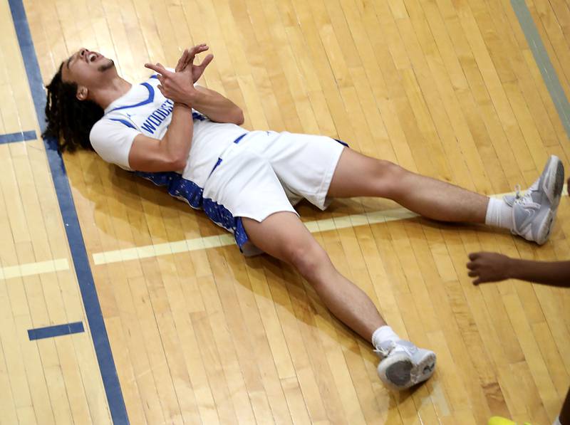 Woodstock North's Devin Quiroz reacts to being fouled during a Kishwaukee River Conference boys basketball game against Woodstock North on Wednesday, February. 18, 2026, at Woodstock High School.