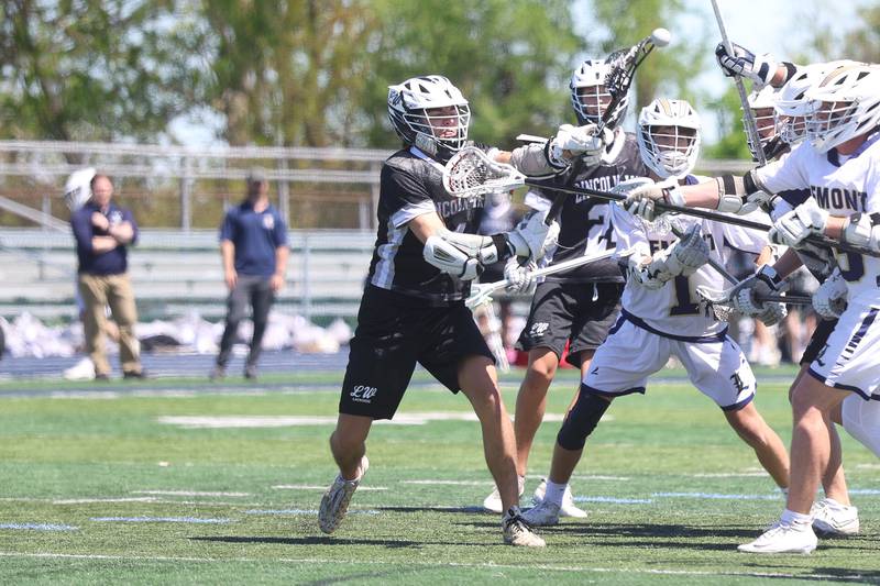 Lincoln-Way’s Logan Hart scores on a contested shot against Lemont on Saturday, April 25, 2026 in Lemont.