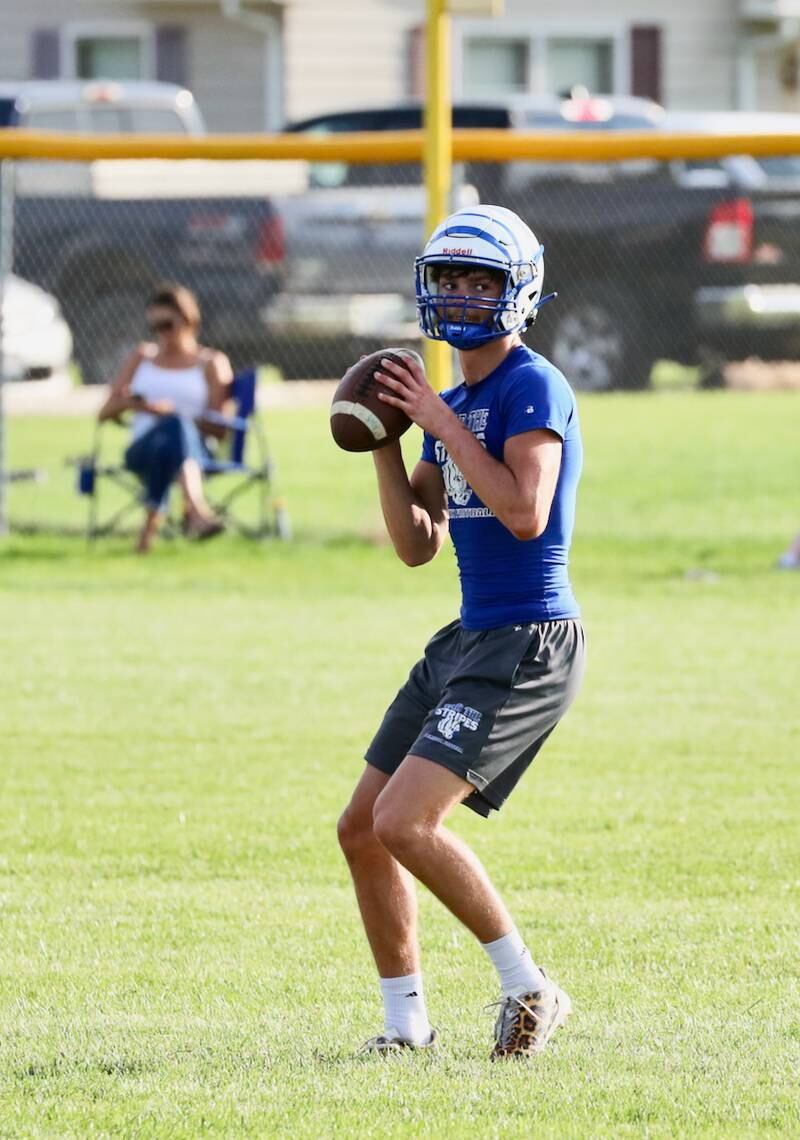 PHS senior quarterback Teegan Davis sizes up a throw during Monday's 7 on 7 game with Bureau Valley at Little Siberia.