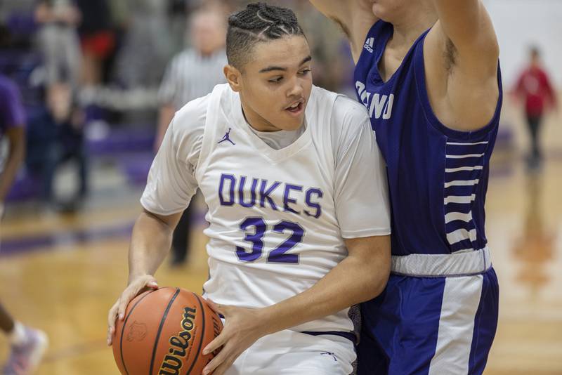 Dixon’s Darius Harrington works below the basket Tuesday, Dec. 13, 2022 against Plano.
