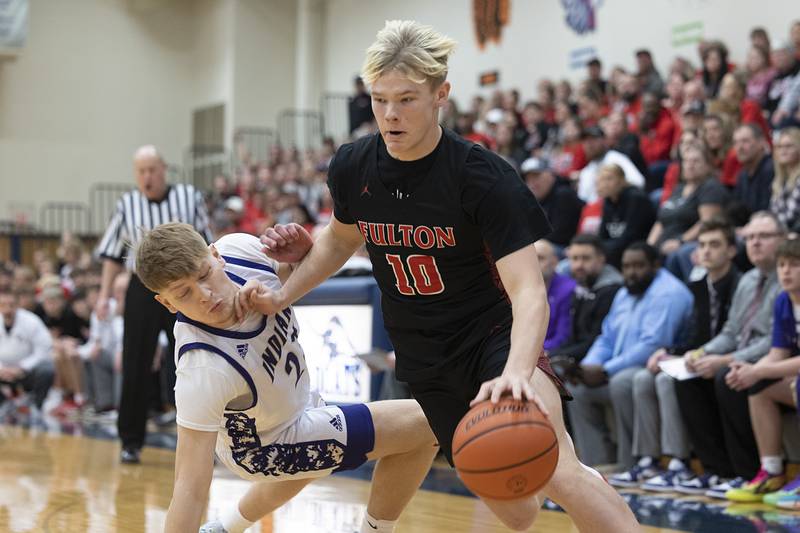 Fulton’s Dom Kramer handlers the ball against Pecatonica’s Jaxon Diedrich during a class 1A sectional semifinal Wednesday, Feb. 28, 2024 at River Ridge High School.