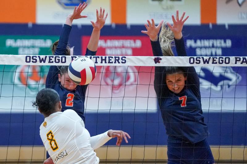 Oswego’s Kelsey Foster (2) blocks a kill attempt by Joliet West's Eden Eyassu (8) during a volleyball match at Oswego High School on Thursday, October 24, 2024.