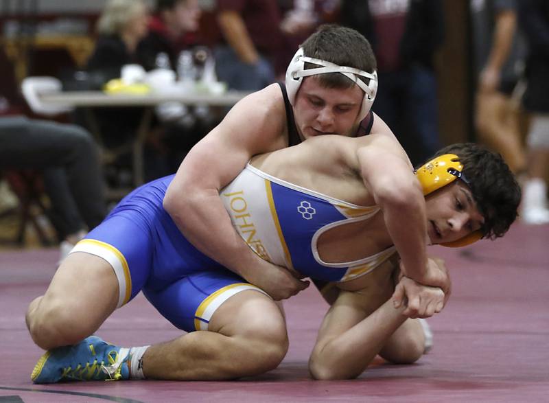 Richmond-Burton’s Blake Livdahl controls Johnsburg’s  Duke Mays in the 175-pound championship match of the IHSA 1A Marengo Wrestling Regional on Saturday, Feb. 8, 2025, at Marengo High School.