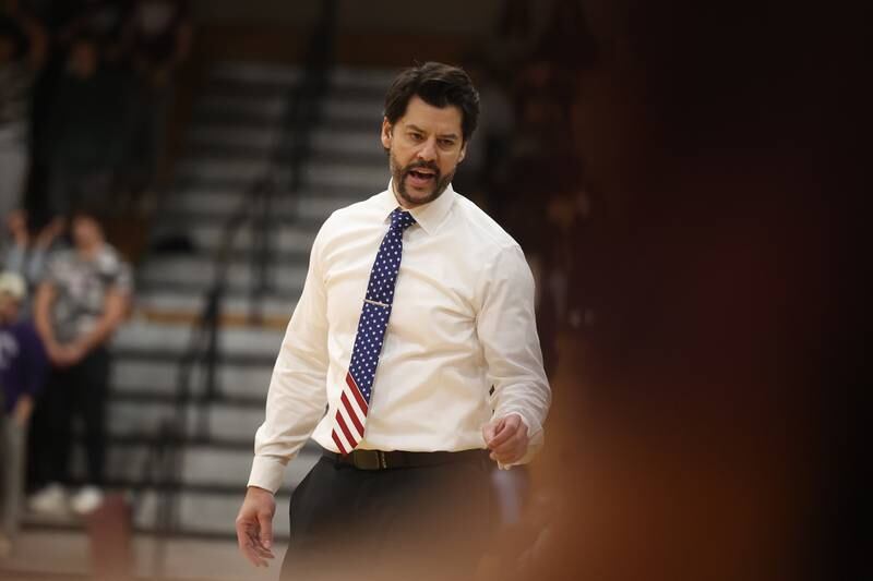 Lockport head coach David Wilson talks to a player during the game against Lincoln-Way East on Friday, Dec. 1, 2023 in Lockport.