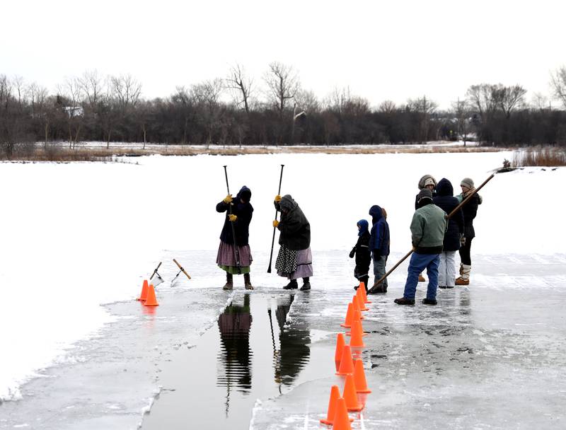 Historical interpreters and participants gather on Timber Lake at Kline Creek Farm to harvest ice on Friday, Jan. 24 2025 in West Chicago.