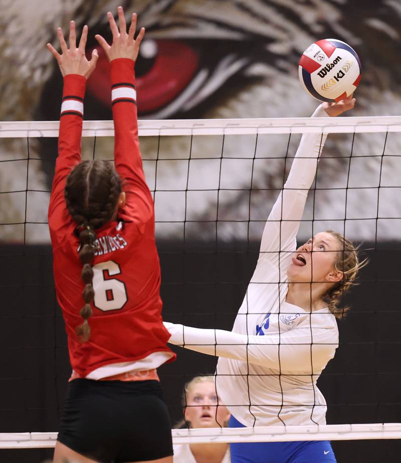 Hinckley-Big Rock's Grace Barrett tries to spike the ball by Indian Creek's Isabella Turner during their match Tuesday, Sept. 19, 2023, at Indian Creek High School in Shabbona.