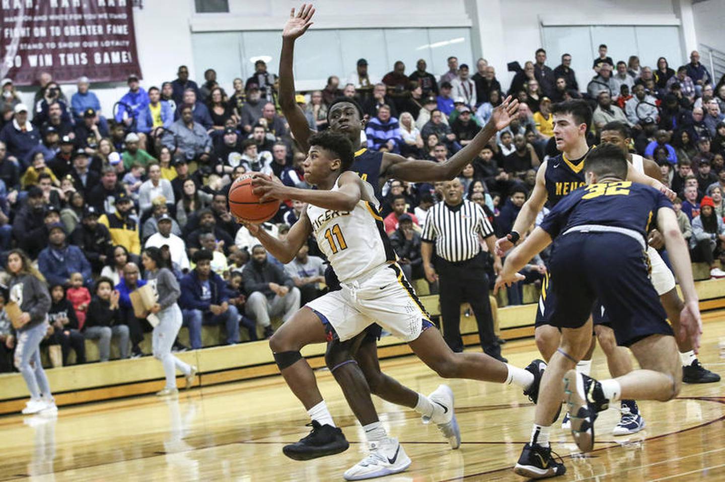 Joliet West's Jeremy Fears Jr. takers takes the ball to the net Tuesday, March 10, 2020, at Lockport Township High School in Lockport, Ill. The Tigers defeated the Wildcats, 50-40.
