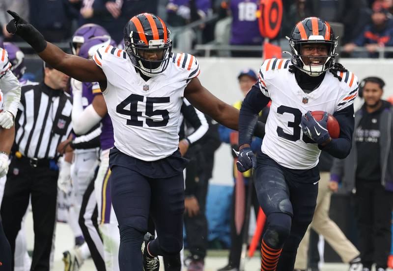Chicago Bears safety Tarvarius Moore (right) celebrates after recovering an onside kick with teammate Amen Ogbongbemiga late in their game against the Minnesota Vikings Sunday, Nov. 24, 2024, at Soldier Field in Chicago.