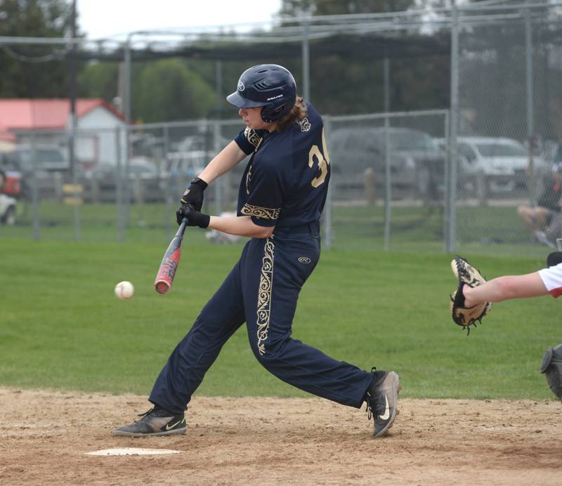 Polo's Scott Robertson connects on a pitch against Oregon during a Saturday, April 27, 2024 game at Oregon High School.