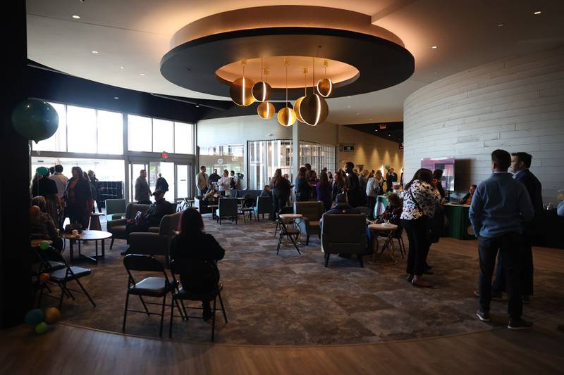 Guest mingle in the lobby at the Ovation Center during the senior care services business space’s ribbon cutting ceremony on Wednesday, April 24, 2024 in Romeoville.