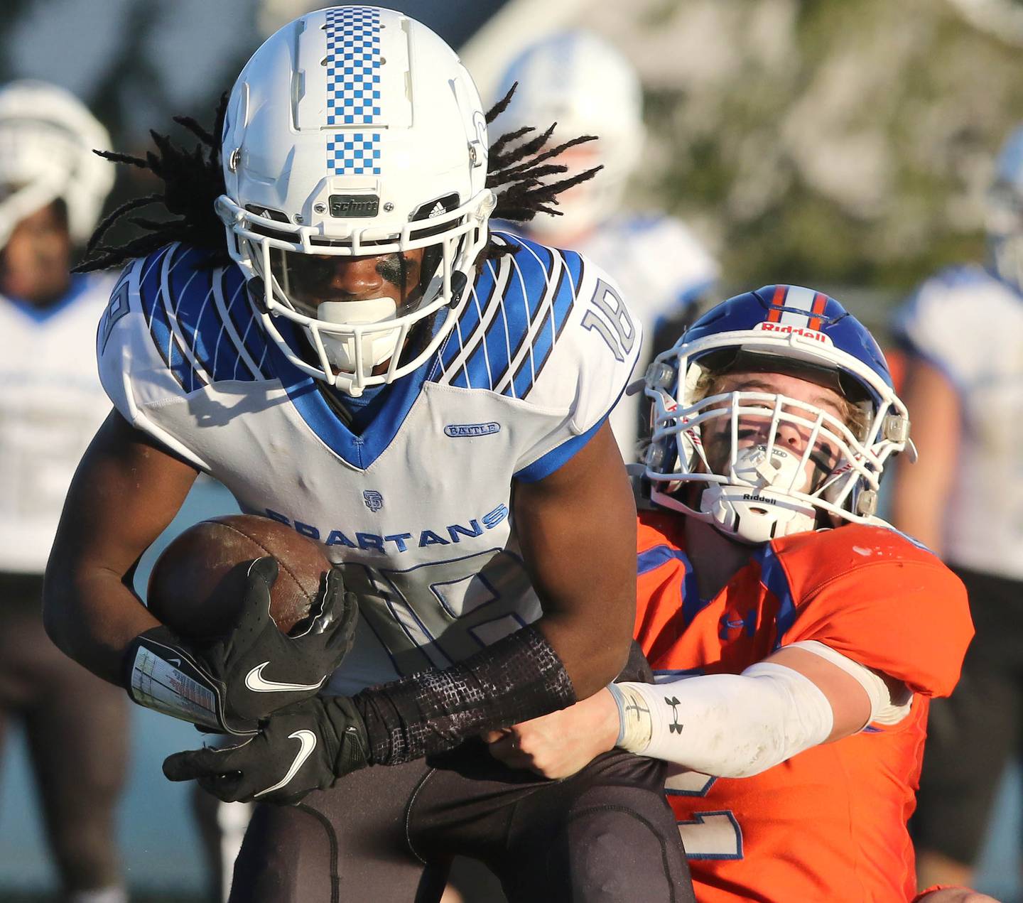 St. Francis' Dash Dorsey is brought down by Genoa-Kingston's Brody Engel after catching a pass Saturday, Nov. 6, 2021, during their IHSA Class 4A state playoff game at Genoa-Kingston High School.