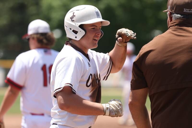 Joliet Catholic’s Zach Pomatto celebrates driving in a run against Spring Valley Hall in the Class 2A Geneseo Supersectional on Monday, May 29, 2023 in Geneseo.