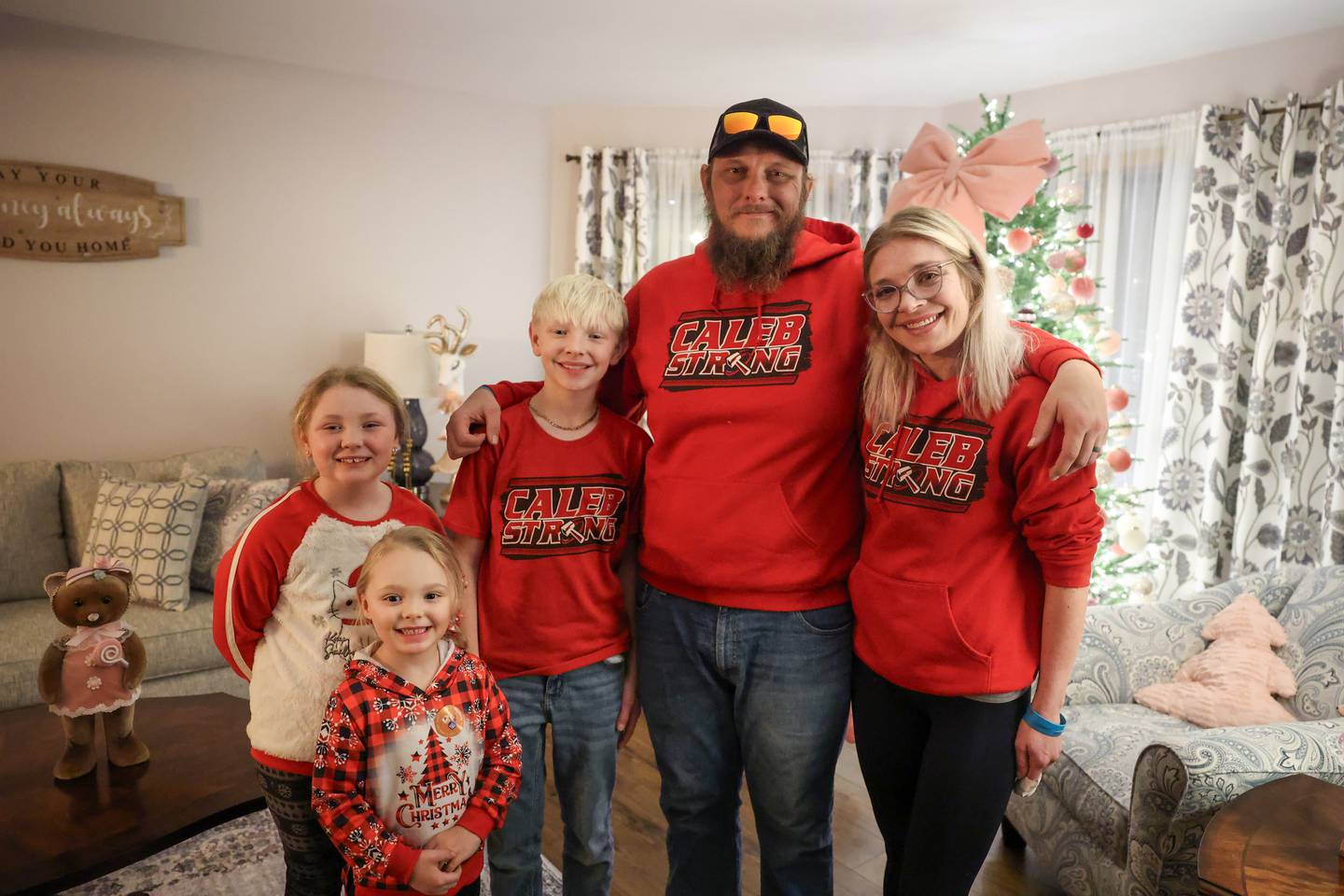 Jennifer and Nick Outerbridge, at right, and their three youngest children, Noah, 11, Ella, 8, and Gracie, 5, are approaching their second Christmas since their oldest son, Caleb, now 17, suffered a rare autoimmune disease just before last Thanksgiving. The family is embracing some of Caleb's favorite traditions this year, such as blasting Christmas music.