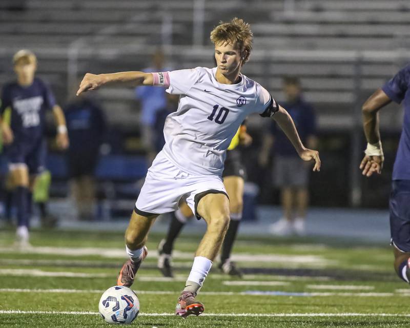 Downers Grove North's Oliver Davies (10) kicks on goal during soccer match between Downers Grove North at Downers Grove South. Oct 2, 2025.