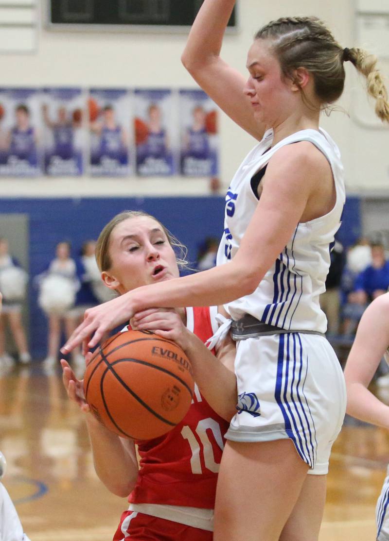 Ottawa's Ella Schmitz is fouled by Princeton's Keighley Davis on Monday, Feb. 5, 2024 in Prouty Gym.