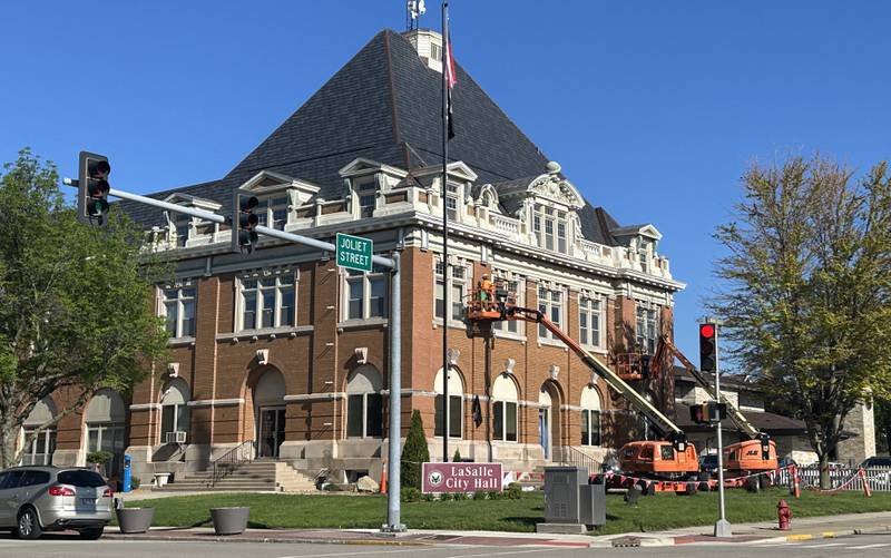 Crews work on tuck-pointing bricks on the exterior of the La Salle City Hall on Tuesday, April 30, 2024.