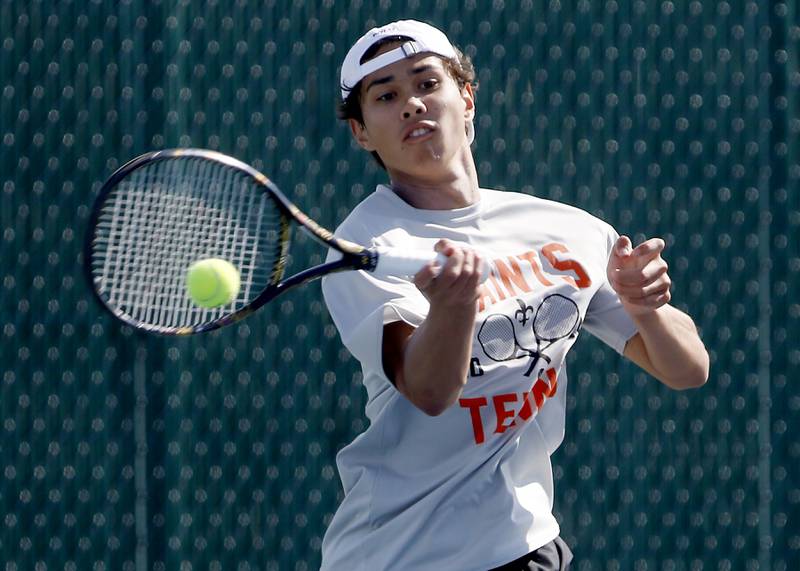 St. Charles East’s Tiernan Price returns the ball as he competes in the Class 2A Boys State Tennis Tournament on Thursday, May 23, 2024, at Hersey High School in Arlington Heights.