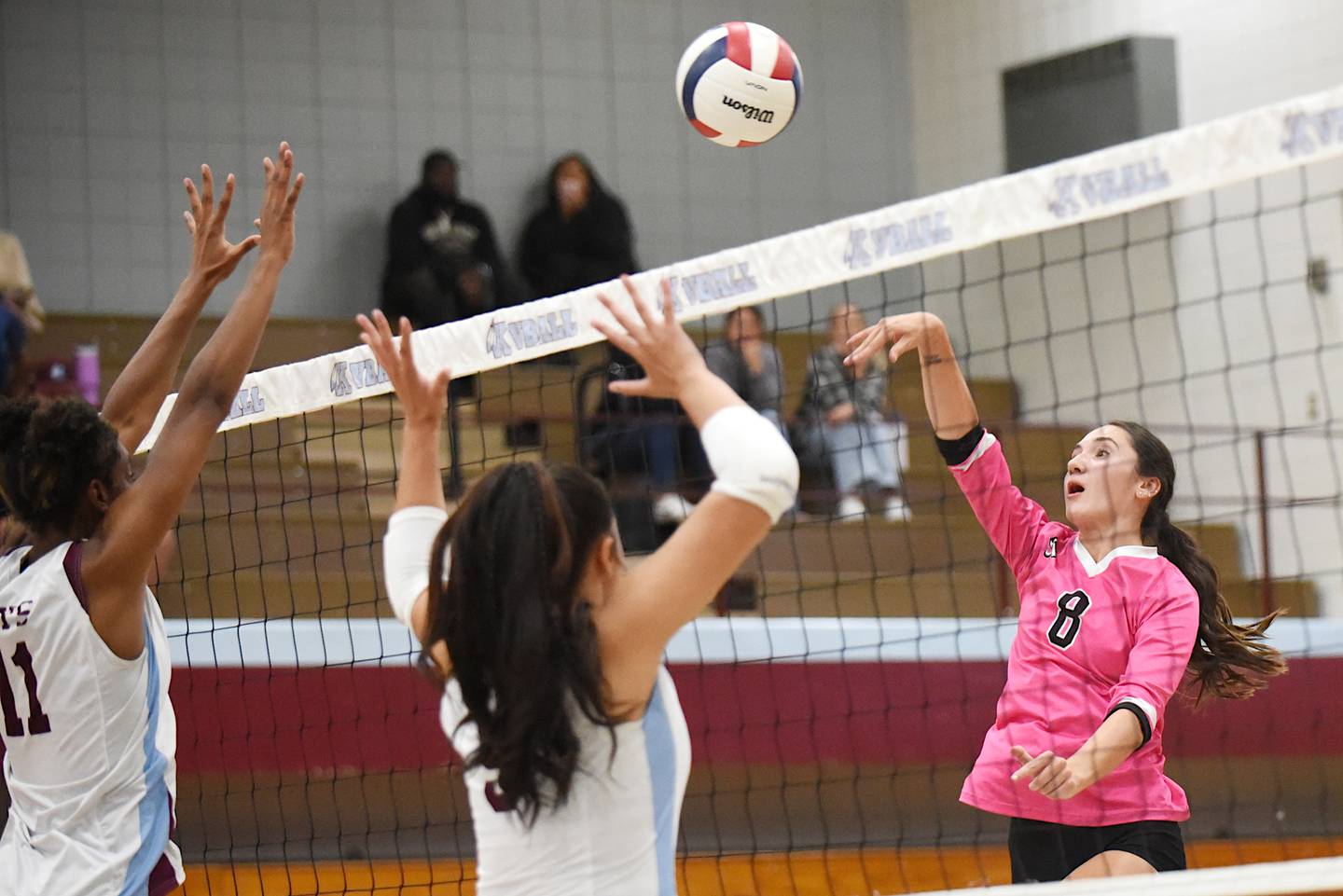 Bradley-Bourbonnais' Hannah Wojnowski, right, hits the ball as Kankakee's Shania Johnson, left, and Karmen Rodgers look to block during All-City action at Kankakee Tuesday, Sept. 9, 2025.