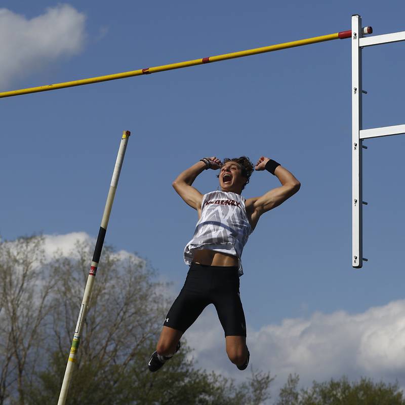 McHenry’s Zachary Galvicius celebrates as he clears 15 feet 4 inches to set a new record in the pole vaults Friday, April 21, 2023, during the McHenry County Track and Field Meet at Cary-Grove High School.