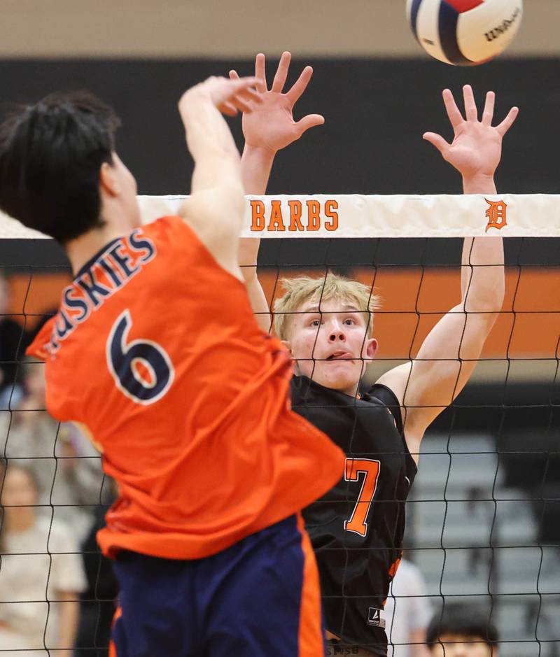 DeKalb’s Grady Fowler goes for a block Tuesday, April 21, 2026 during their match against Naperville North JV at DeKalb High School.