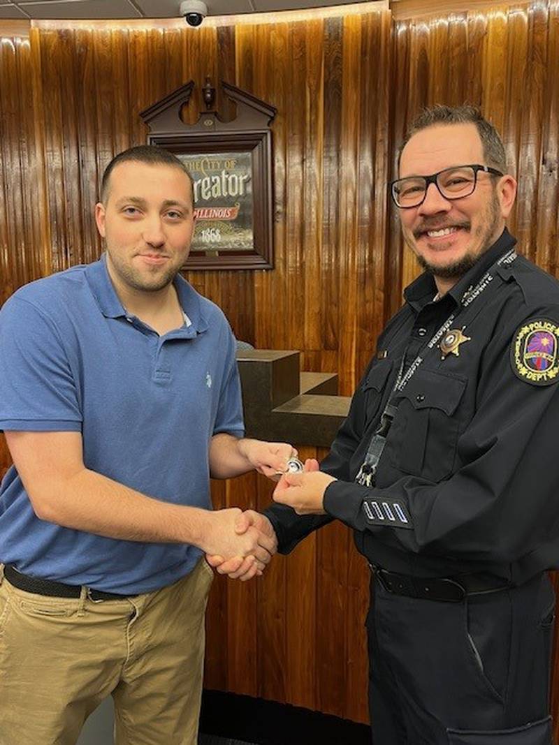 Andrew Gotch (left) is sworn in as the newest officer of the Streator Police Department by Deputy Chief Robert Wood during a ceremony at Streator City Hall on Monday morning.