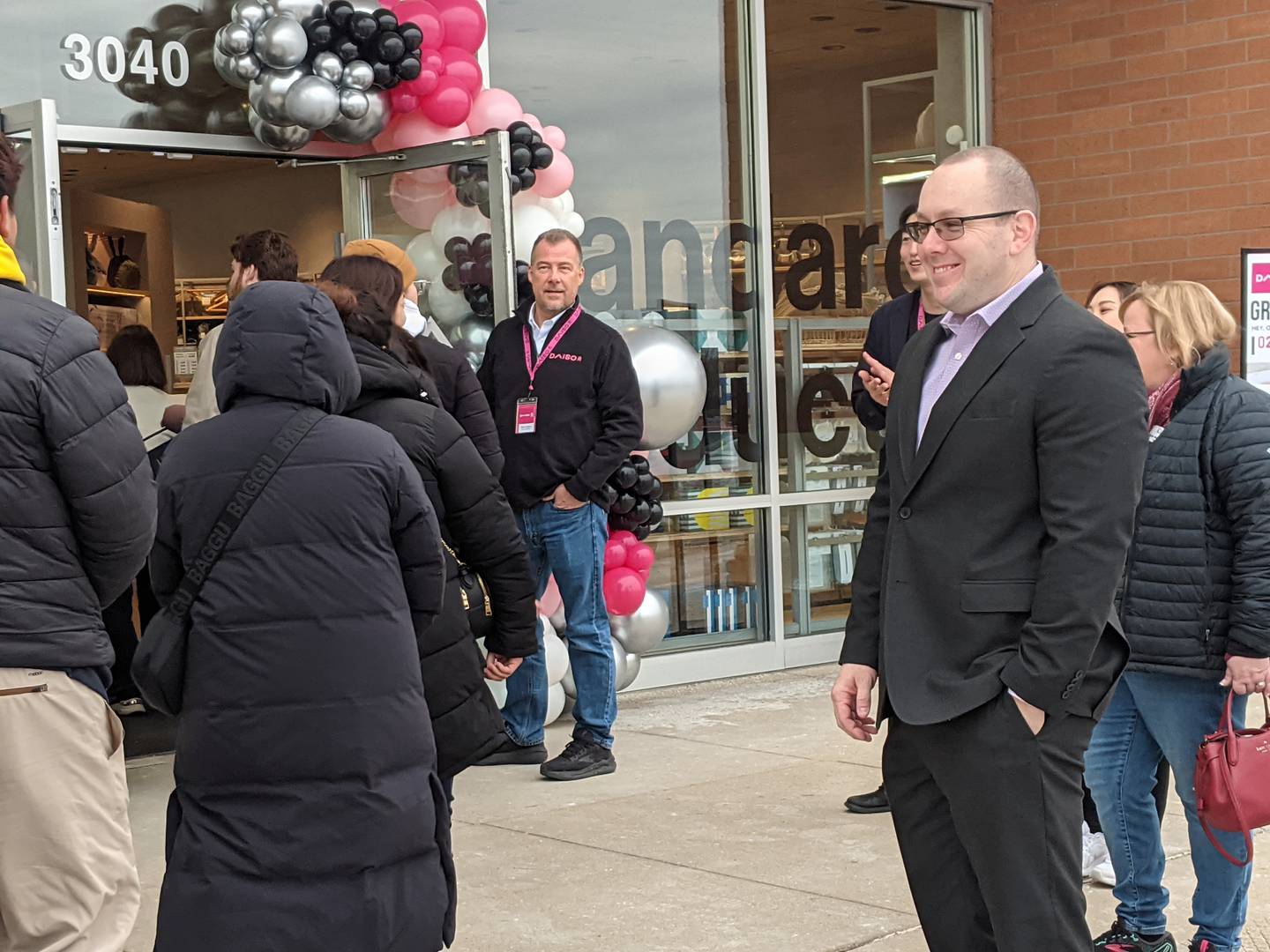 Oswego Village President Ryan Kauffman greeted customers as they stood in line Feb. 8 at the grand opening of the new Daiso store in Oswego.