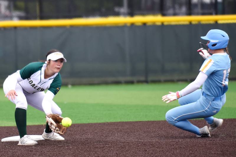 Coal City's Kaycee Graf, left, fields a throw at second base as Joliet Catholic's Molly Ryan slides in during the Class 2A Coal City Regional semifinals Wednesday, May 21, 2025.