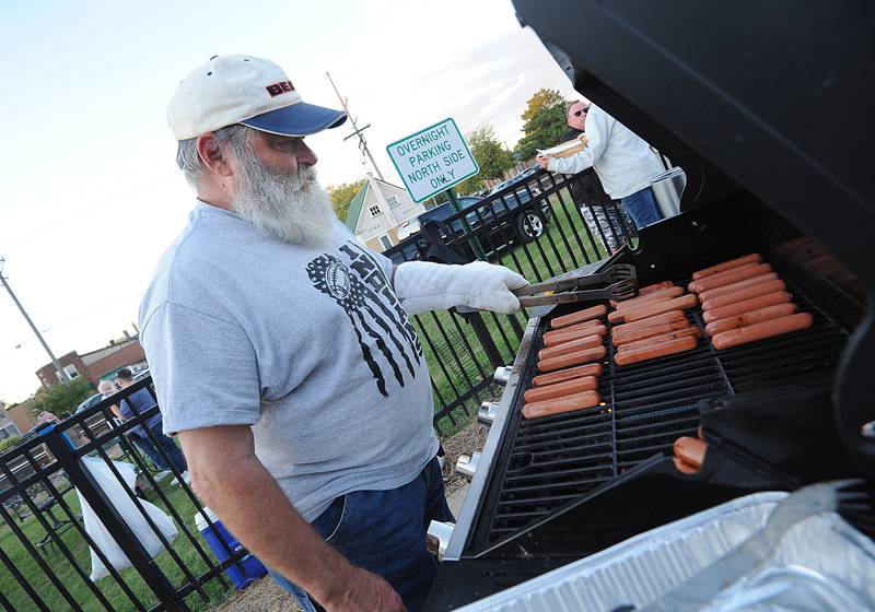 Sandwich 3rd Ward Alderman Bill Fritsch mans the hot dog grill for the city of Sandwich during the Taste of Sandwich, Wednesday, Sept. 25, 2024, on Main Street in downtown Sandwich.
